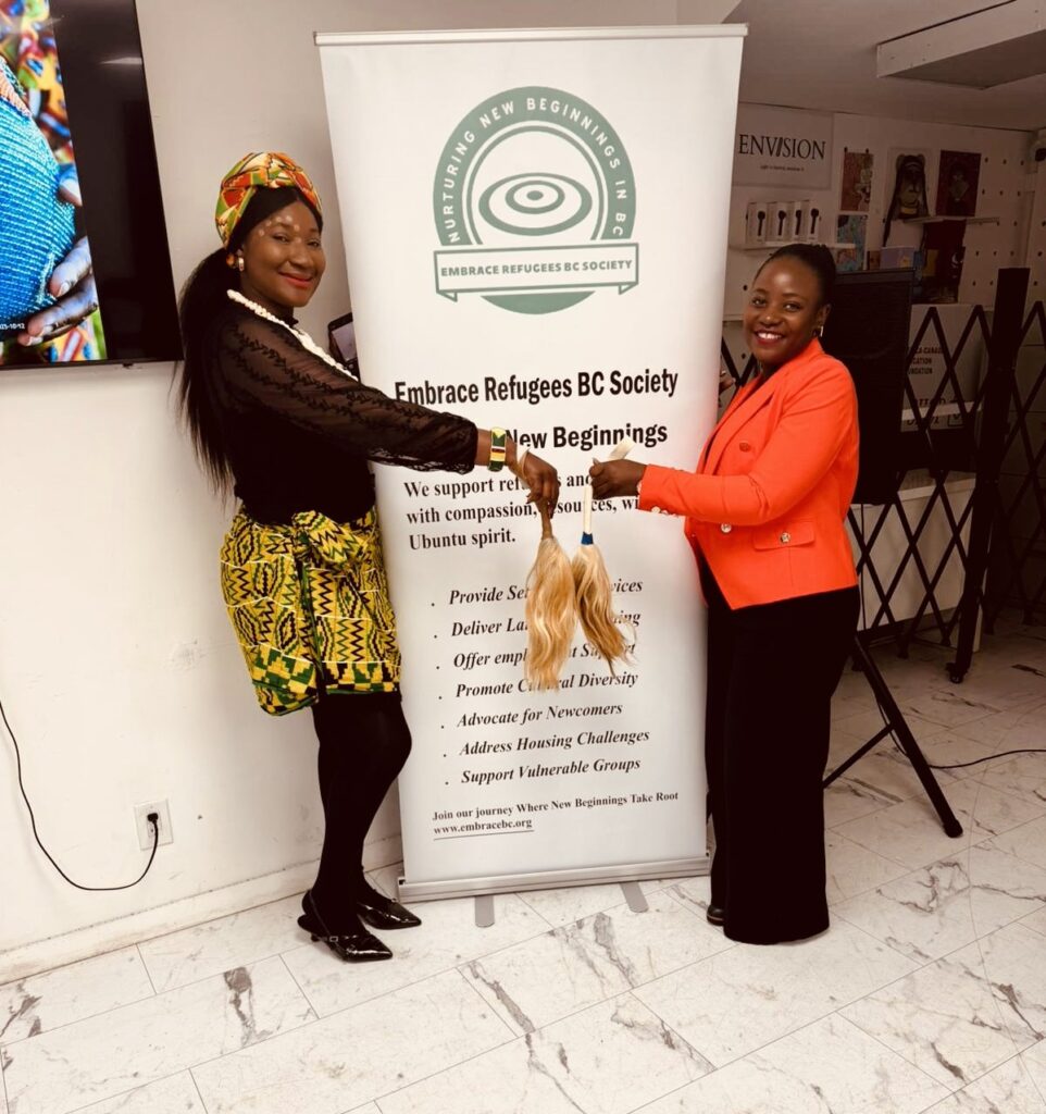 Adjoua Flora Cynthia Kra with Sheebah a volunteer at Embrace Refugees BC Society.